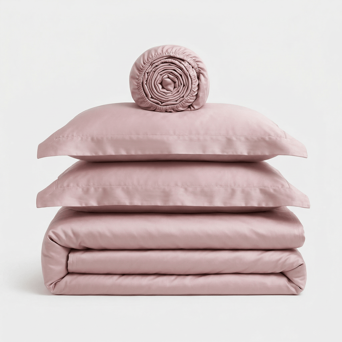 Minimalist Rose bedding set, folded: duvet cover, two pillowcases and a rolled sheet