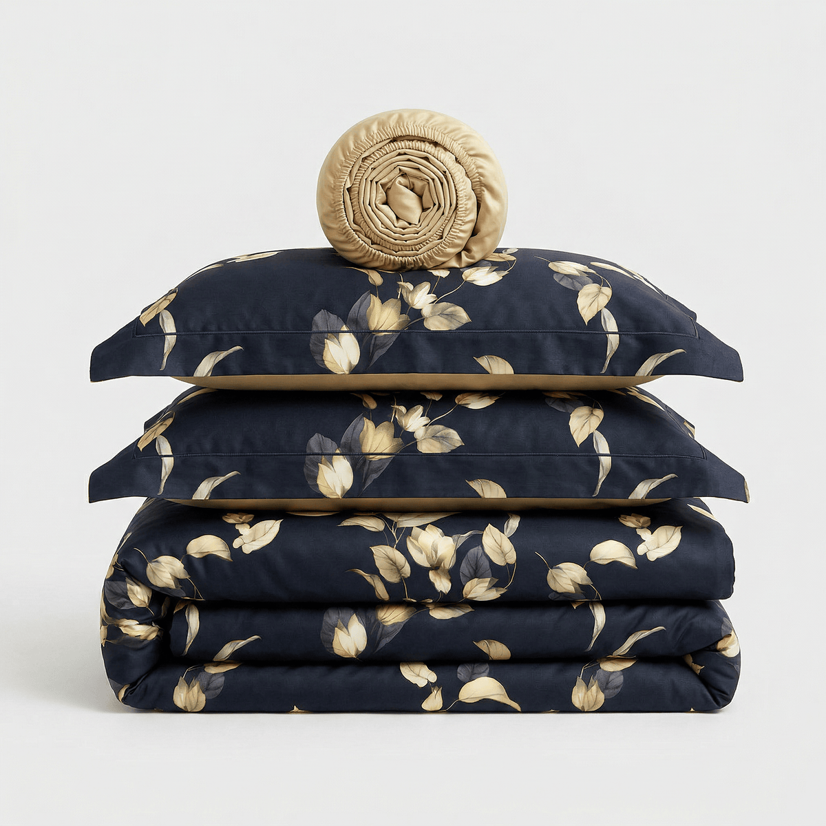 Gold Leaves bedding set, folded: duvet cover, two pillowcases and a rolled sheet