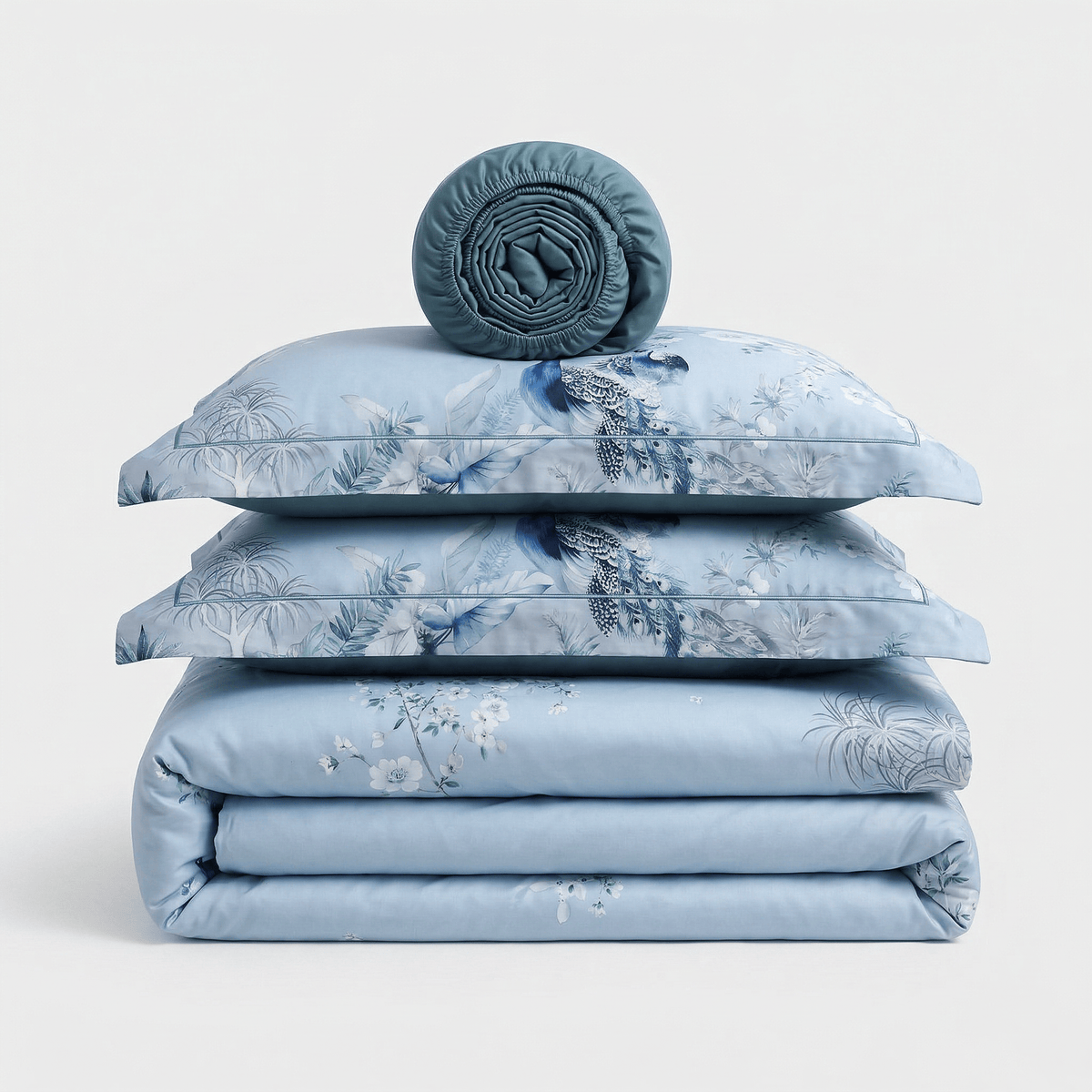 Blue Birds bedding set, folded: duvet cover, two pillowcases and a rolled sheet