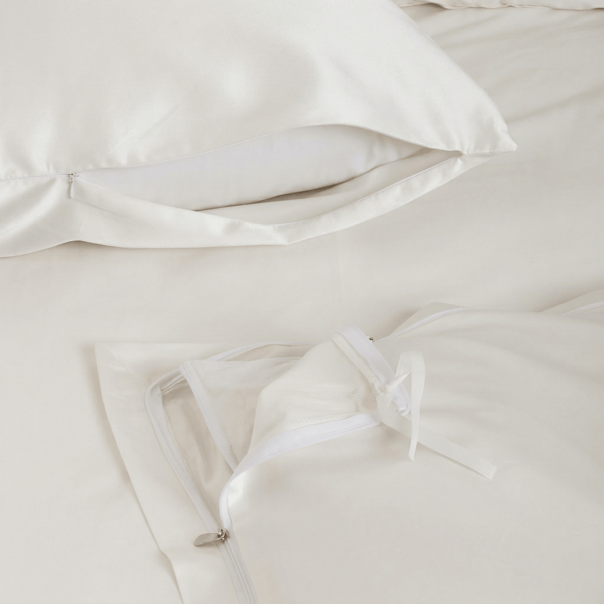 Ivory Easy Change duvet cover zip detail with corner tie, and pillowcase side zip
