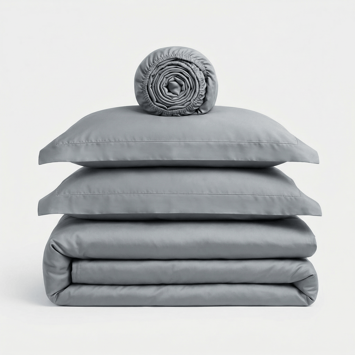 Minimalist Grey bedding set, folded: duvet cover, two pillowcases and a rolled sheet