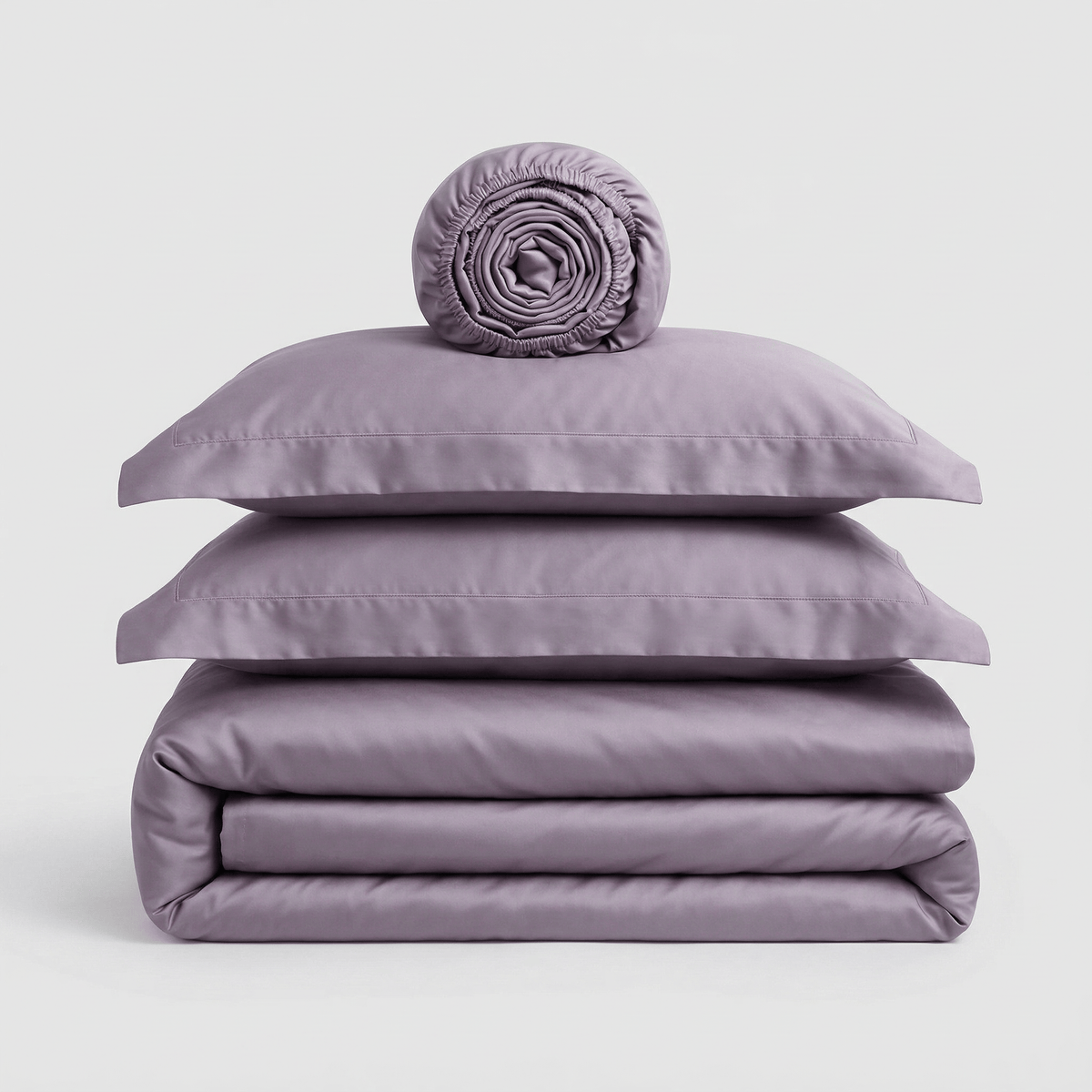 Minimalist Violet bedding set, folded: duvet cover, two pillowcases and a rolled sheet